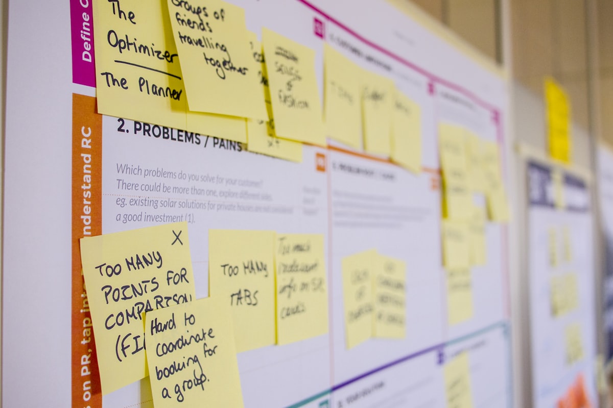Printed notes arranged in columns on a board