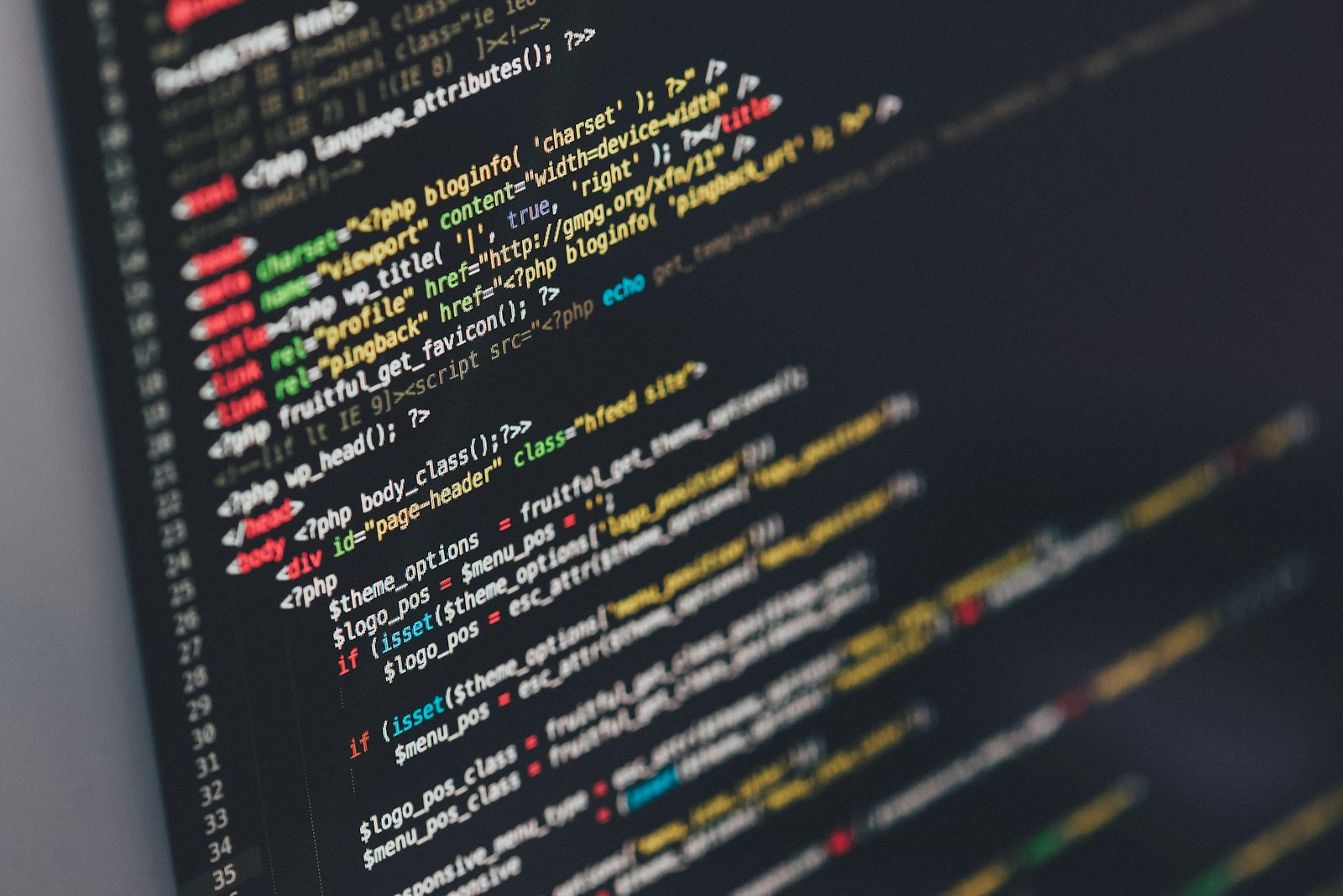 A monitor showing code and analytics