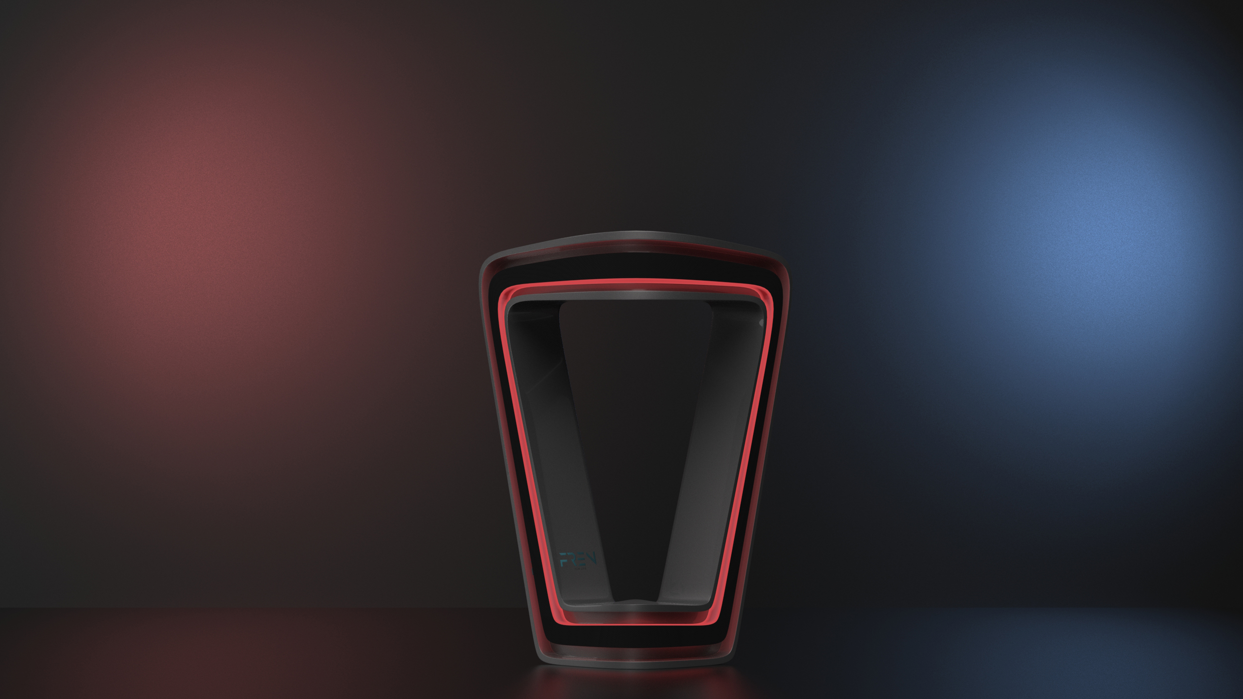 The Fren lamp lit in red against a dark room, blue light washing the wall behind it