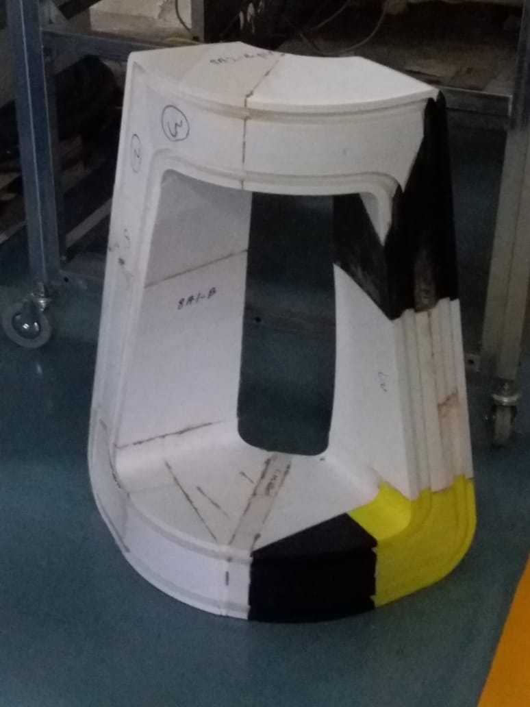 Full-size 3D printed model of the Fren lamp on a workshop floor, sections marked up and part-finished