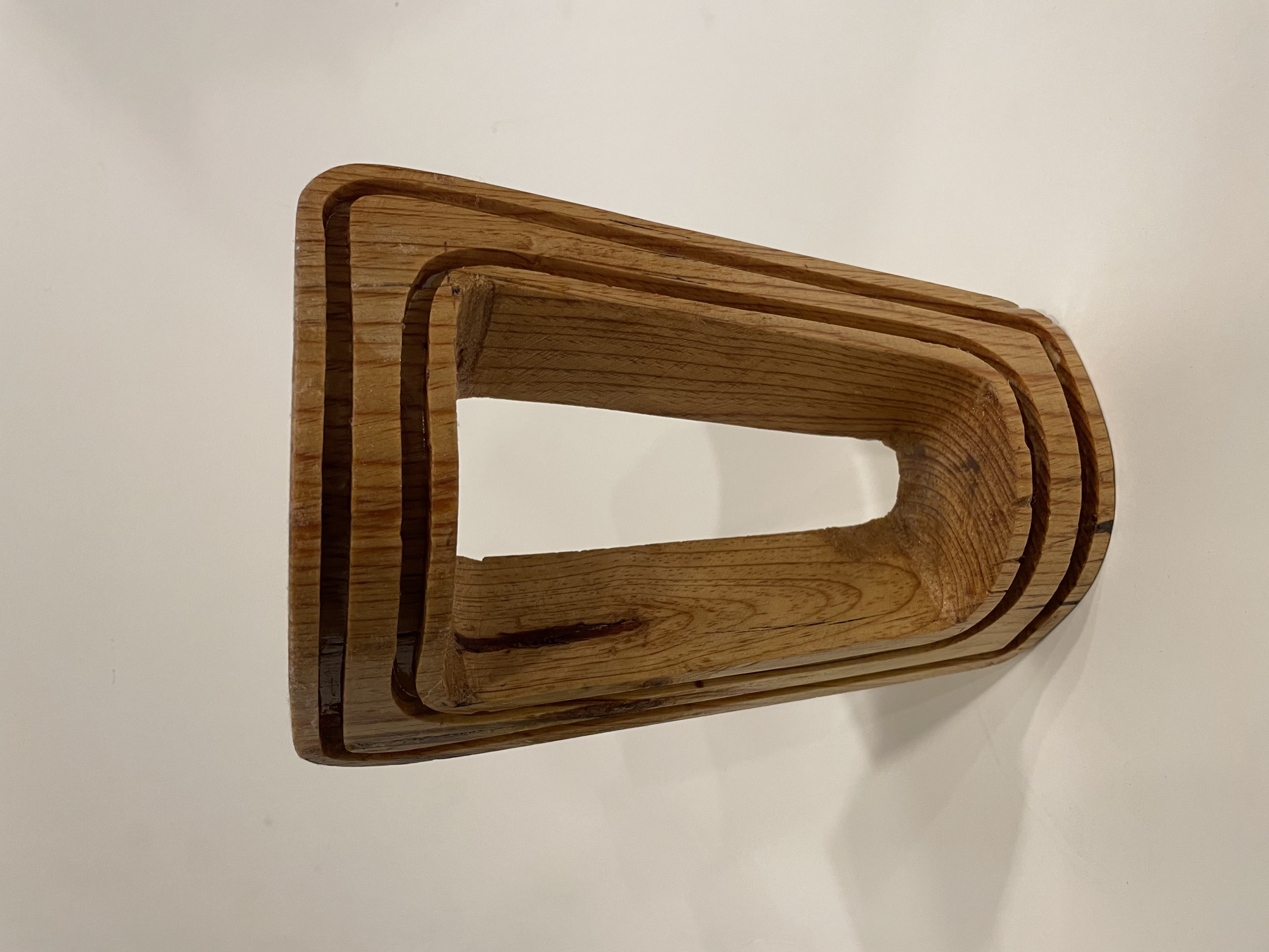 Quarter-scale wooden model of the Fren lamp, stacked laminations showing the tapered archway profile