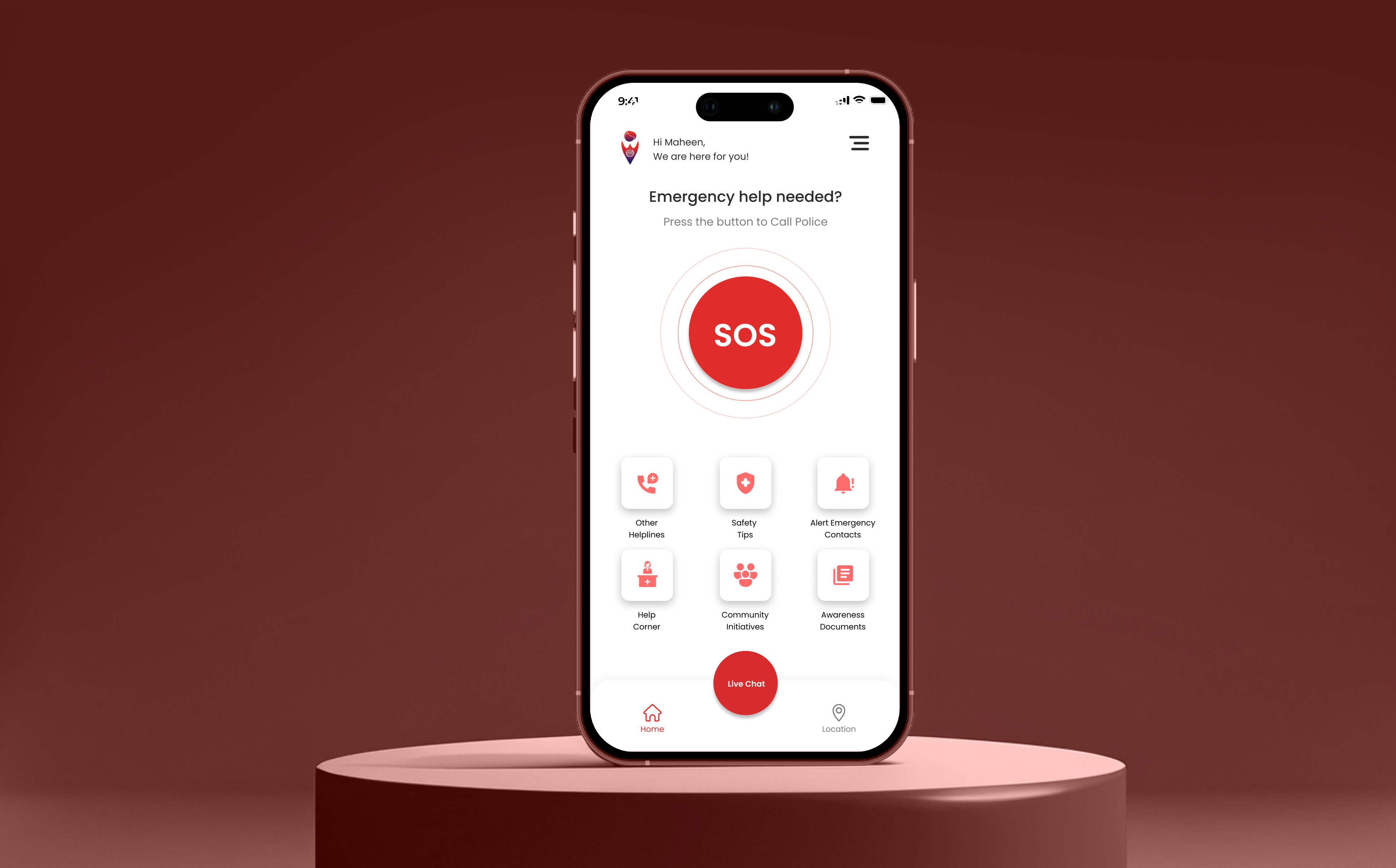 The app home screen on a phone standing on a deep red podium